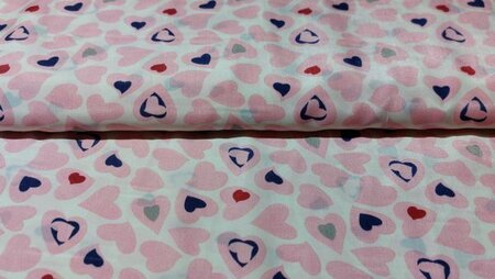 Witte voeringsstof met gekleurde hartjes