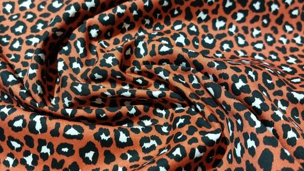 Bestel Brique rode katoen met panterprint