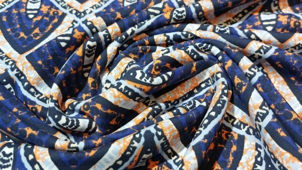 Bestel blauwe Joggingstof (French Terry) met abstracte driehoeken 