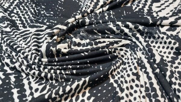 Prachtige Zwart wit viscose tricot met abstracte bolletjes print  bestellen