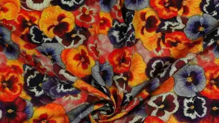 Oranje viscose stof met flower power kopen 