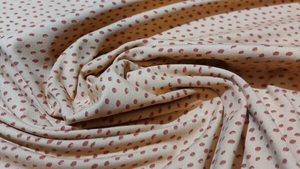 Bestel eenvoudig Terra kleurige katoen tricot stof met stippen
