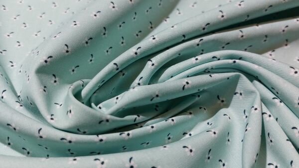 Close-up mintgroene katoen met bloemetjes	