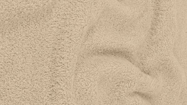 Detail van de structuur van de taupe badstof van dichtbij
