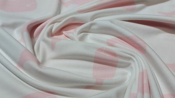 Prachtige babystof kopen: Witte katoen tricot met roze walvissen