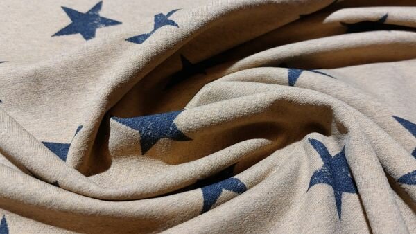 Naaien met Cognac kleurige sweat French Terry stof met zwarte sterren