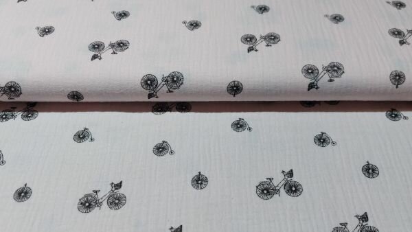 Katoenen mousseline in lichtroze met fietsjes