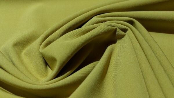 Structuur en kleur van Orlando broekenstof in mosterdgeel