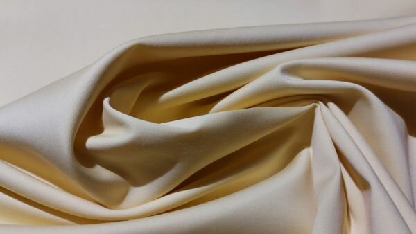 Detail van de geweven Rialto broekenstof in lichtgeel	