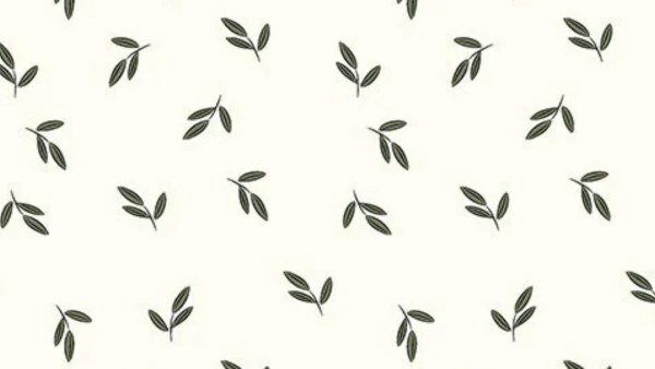 Off white poplin katoen met donkergroene bladeren