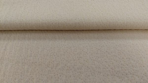 Beige ajour jacquard pointelle katoen stof close-up textuur