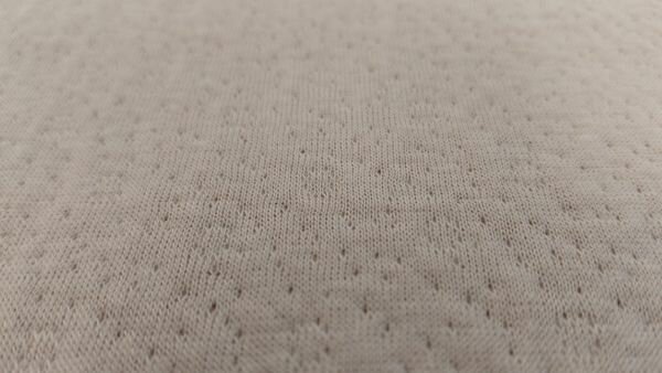 Detail ajour katoenen stof met open patronen