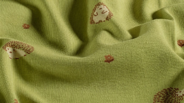 Groene katoen tricot dierenprint