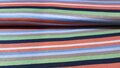 Gestreepte tricot stof (Oranje, lila, blauw, zwart en groen)