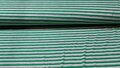 Gestreepte tricot stof (groen, wit en grijs)